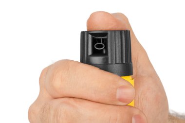 Hand with bottle of pepper spray clipart