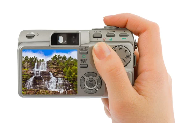 Hand with camera and Norway travel photo — Stock Photo, Image