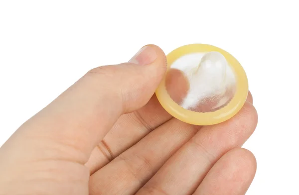 Kondom i hånden - Stock-foto