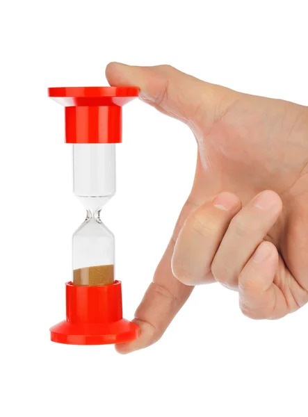 Hand with hourglass Stock Picture