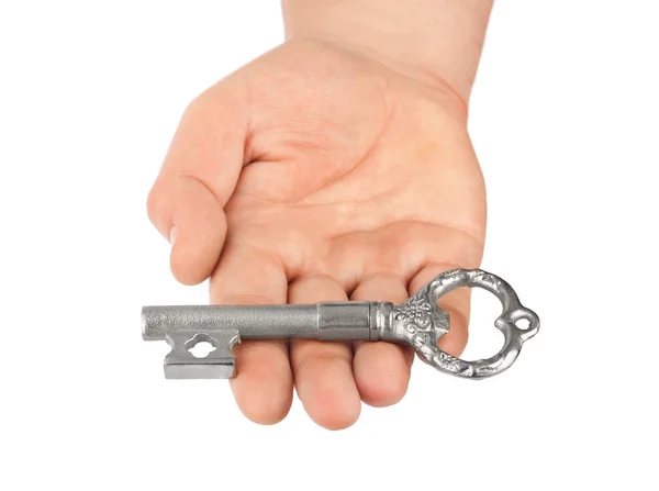 Mão com chave de prata retro — Fotografia de Stock