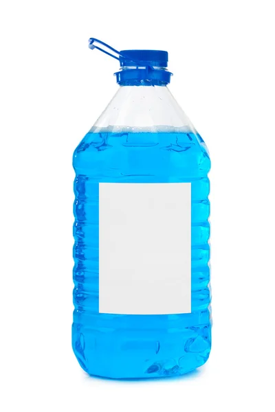 Fles met blauwe vloeibare en lege label — Stockfoto