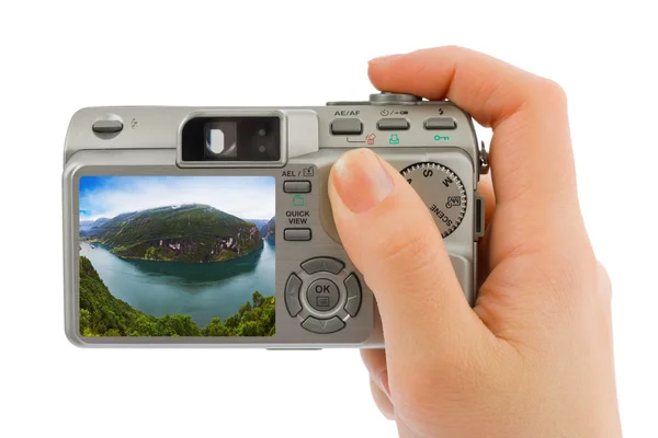 Hand with camera and Norway travel photo — Stock Photo, Image