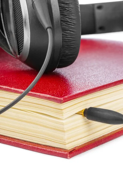Ακουστικά και το βιβλίο — Φωτογραφία Αρχείου