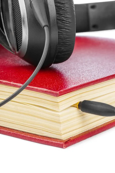 Auriculares y libro — Foto de Stock