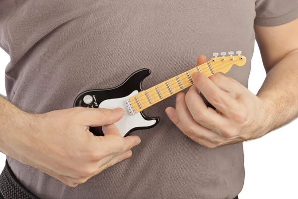 Hands and toy electric guitar — Stock Photo, Image