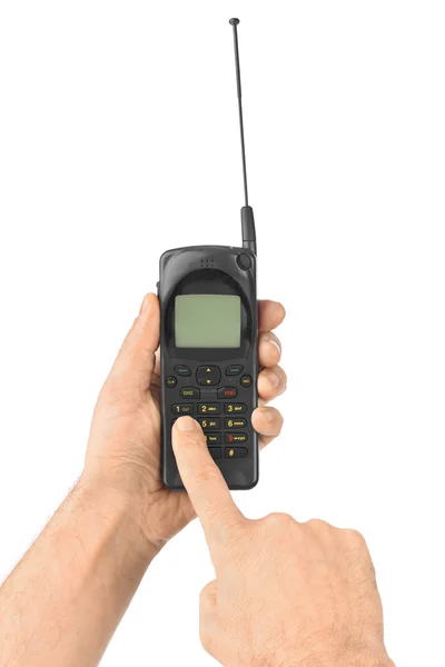 Hand met retro mobiele telefoon — Stockfoto