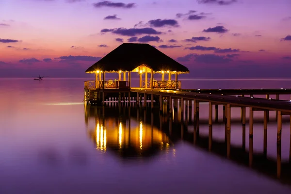 Water cafe at sunset - Maldives — Stock Photo, Image