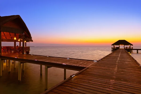 Water cafe at sunset - Maldives — Stock Photo, Image