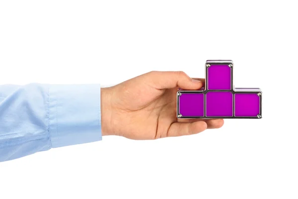 Hand med tetris leksak block — Stockfoto