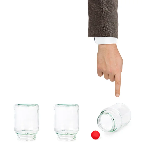 Hand and shell game with glass jars — Stock Photo, Image