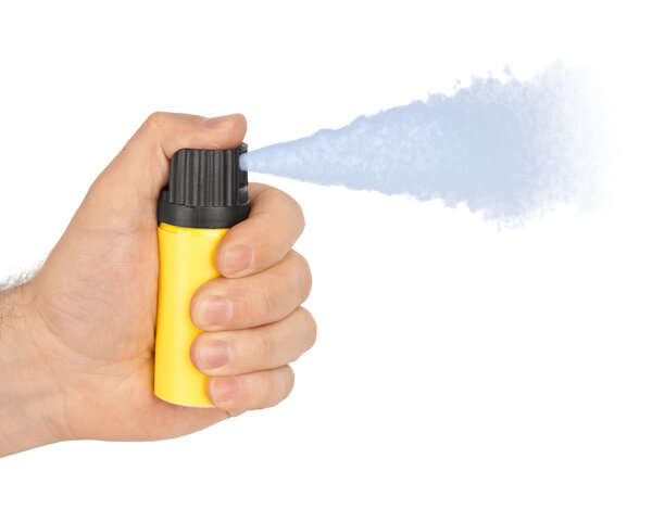 Hand with bottle of pepper spray