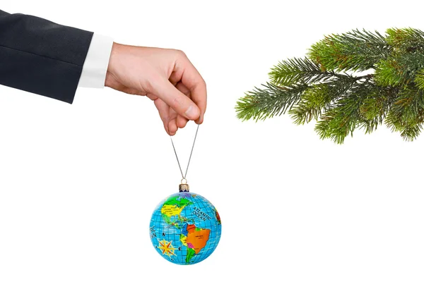 Hand with earth and Christmas tree — Stock Photo, Image