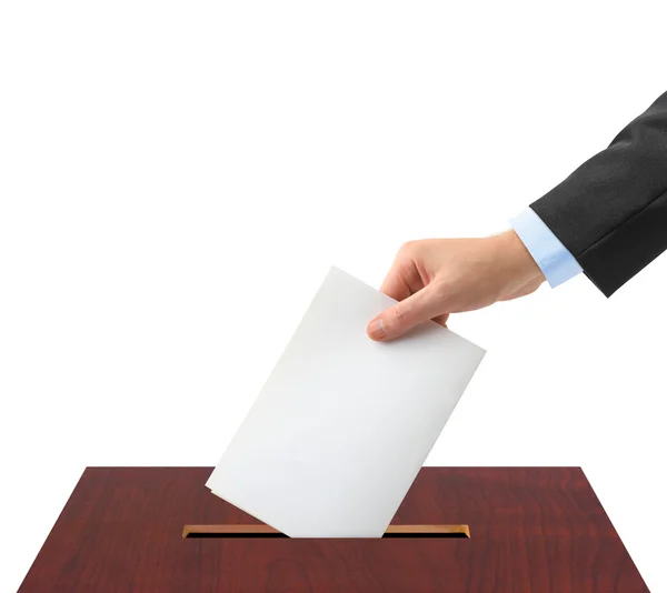Main avec bulletin de vote et urne — Photo