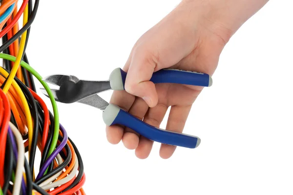 Hand with pliers and cable — Stock Photo, Image