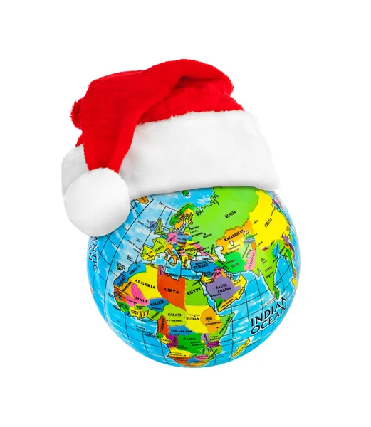 Globe and Santa Claus red christmas hat — Stock Photo, Image