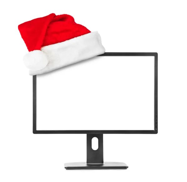 Computermonitor und Weihnachtsmann rote Weihnachtsmütze — Stockfoto