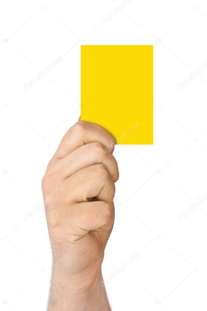 Hand holding a yellow card