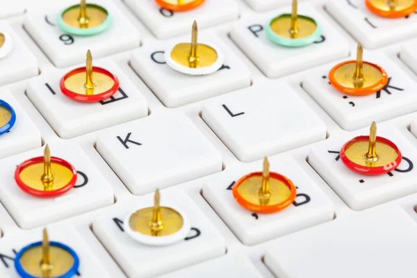 Pins on computer keyboard — Stock Photo, Image