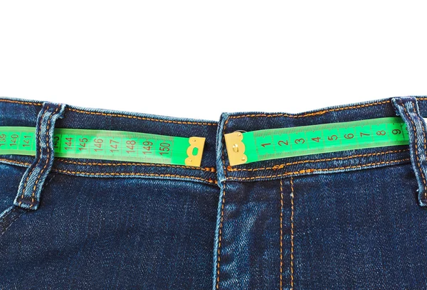 Jeans e fita métrica - conceito de emagrecimento — Fotografia de Stock