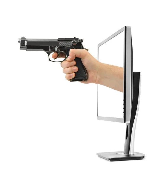 Hand mit Waffe und Computermonitor — Stockfoto