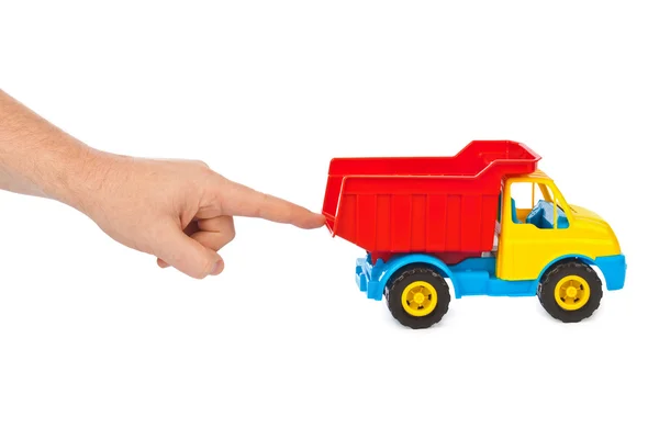 De vrachtwagen van de auto van speelgoed en hand — Stockfoto