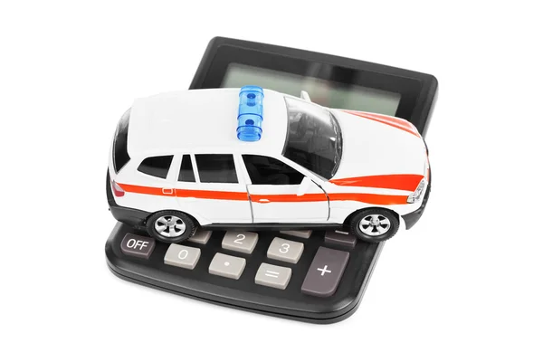 Hesap makinesi ve oyuncak polis arabası — Stok fotoğraf
