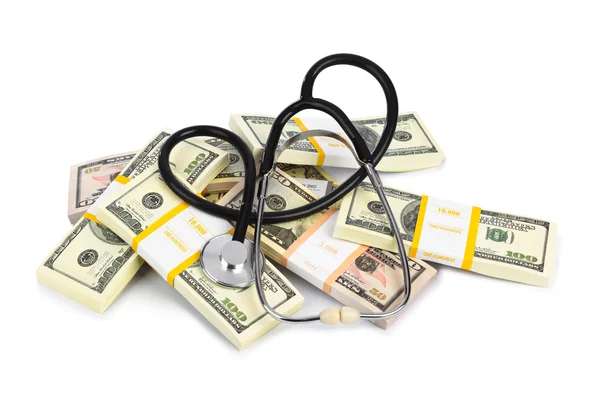 Stetoskop a peníze — Stock fotografie