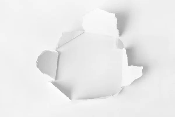 Hole punched in the paper — Stock Photo, Image
