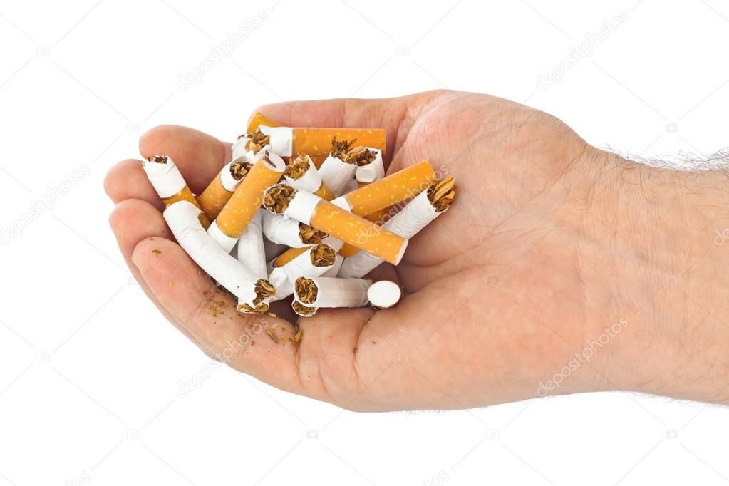 Broken cigarettes in hand