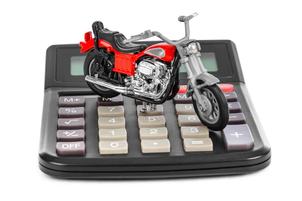 Taschenrechner und Spielzeug-Motorrad — Stockfoto