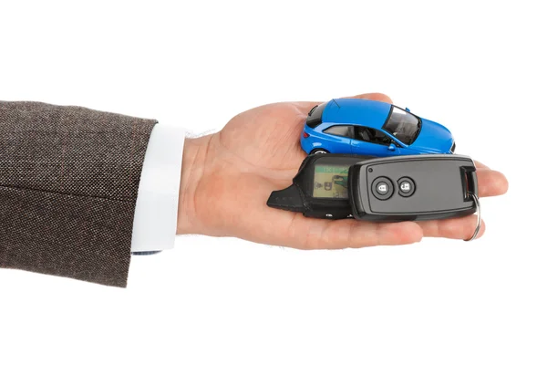 Hand with keys and car — Stock Photo, Image