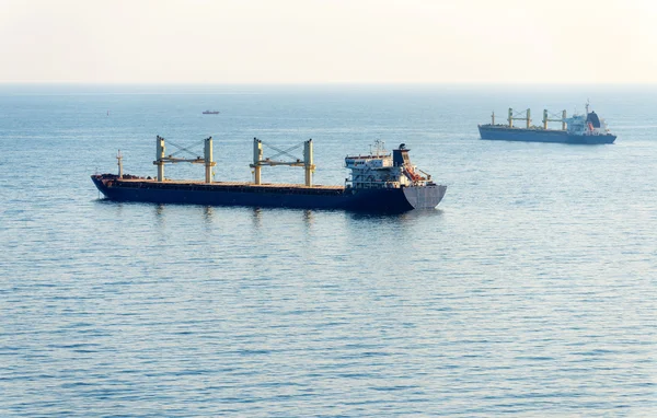 Cargo ship sailing in still water — Stock Photo, Image