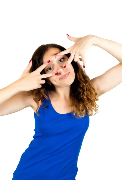 Young cheerful woman looking through fingers — Stock Photo, Image