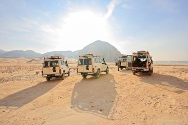 Sinai, Egypt - December 20, 2014: Safari Jeeps clipart