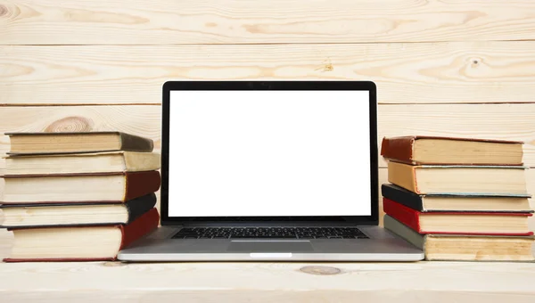 Stack of books and laptop — Stock Photo, Image