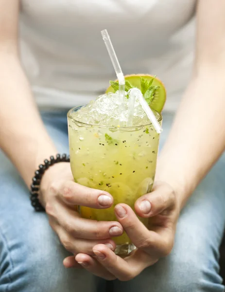 Woman with cocktail in hands