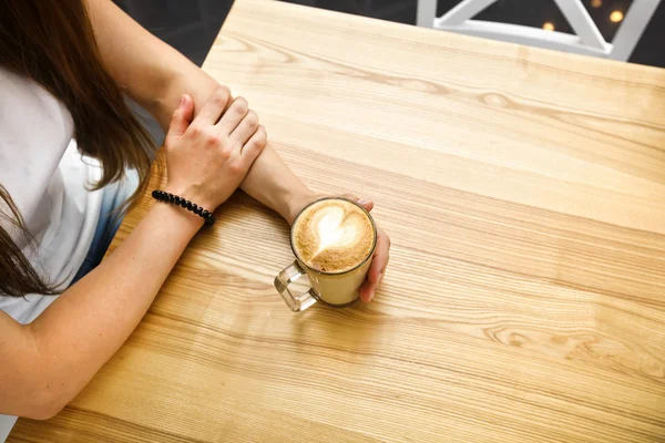 Girl holding cup of coffee — Stock Photo, Image