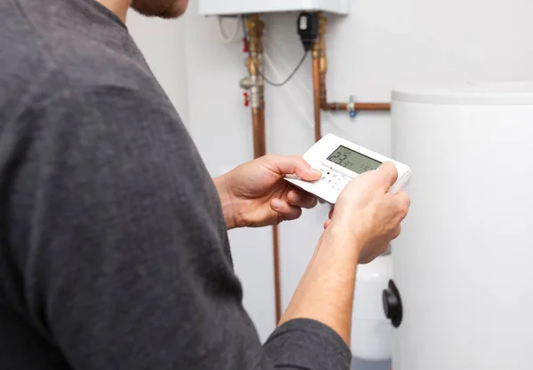 Man Adjusts Thermostat Boiler Room — Stock Photo, Image