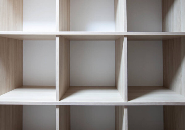The empty shelves in the wardrobe
