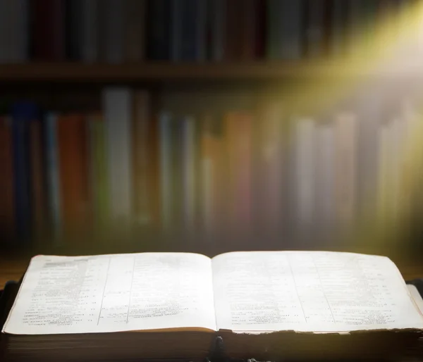 Old book on wooden table — Stock Photo, Image