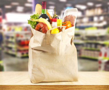 Supermarket and bag with products clipart
