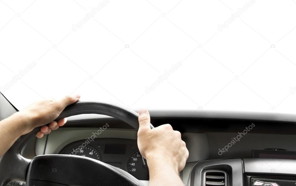 Hands of a driver on steering wheel