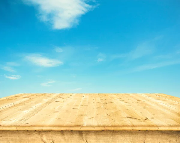 Wooden boards over a blue sky — Stock Photo, Image