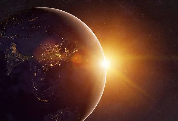 Earth in cosmos and bright sun — Stock Photo, Image