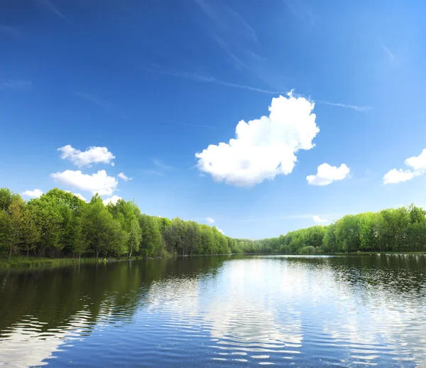 Lake with reflections of clouds — Stock Photo, Image