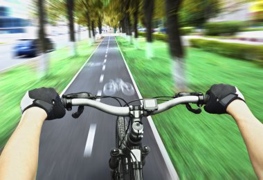 Cyclist riding on bike clipart