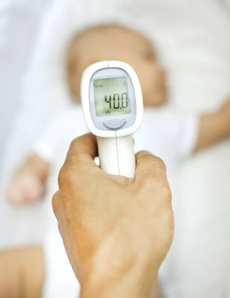 Thermometer in male hand — Stock Photo, Image