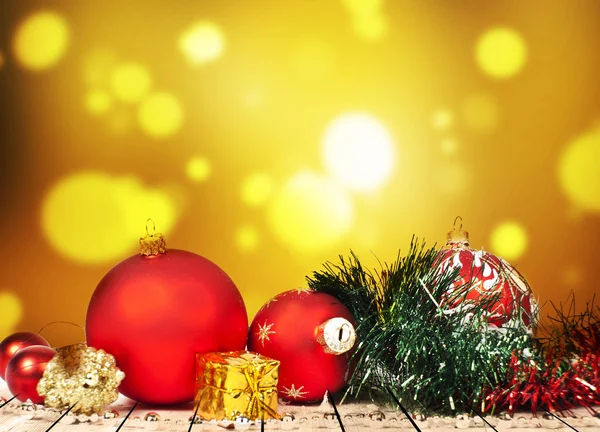 Christmas golden present and balls — Stock Photo, Image