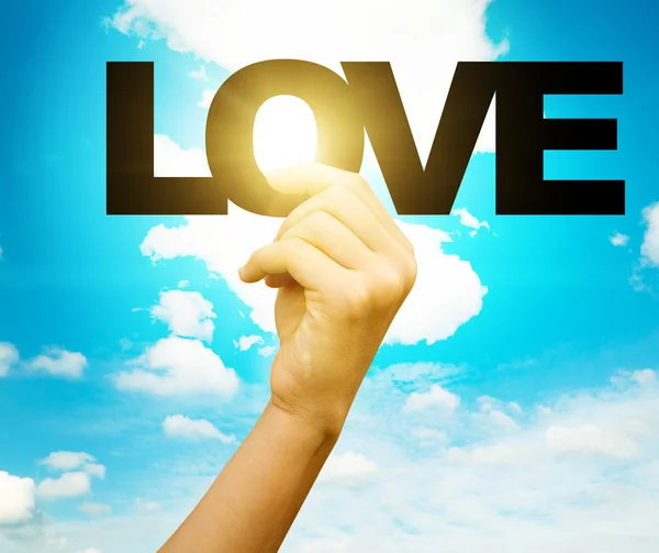 Word love in woman hand — Stock Photo, Image